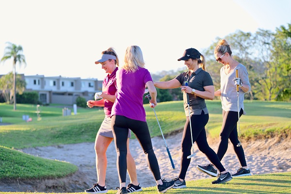 ladies playing golf